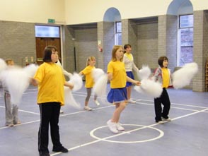 A cheerleading class in action.